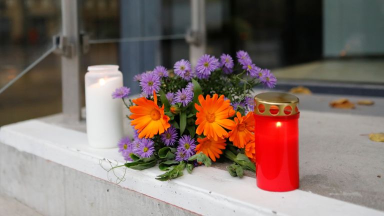 Flowers and candles left at the door of the Uppsala Konsert & Kongress venue following the incident