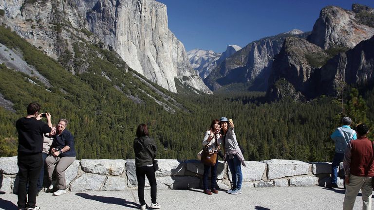 FILE - Visitors at Tunnel View enjoy the views of Yosemite National Park, Calif., on Oct. 17, 2013. The U.S. Senate has unanimously approved the nomination of Charles ...Chuck... Sams III as National Park Service director, which will make him the first Native American to lead the agency that oversees more than 131,000 square miles of parks and other landmarks. (AP Photo/Gary Kazanjian, File)                                                                                                                                                                                                                                                                             