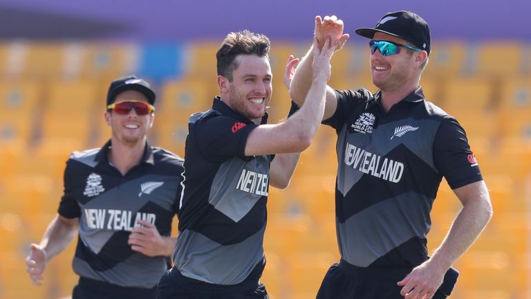 New Zealand&#39;s Adam Milne 9L) celebrates a wicket with Jimmy Neesham at the T20 World Cup (Associated Press)