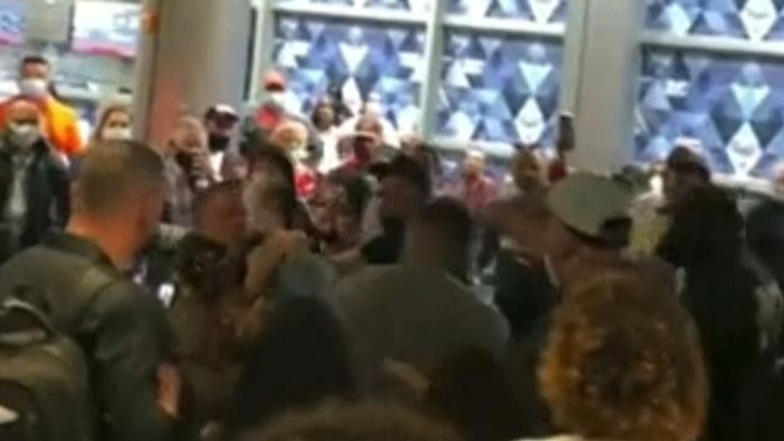 Florida: Fight breaks out between travellers and police at Miami ...