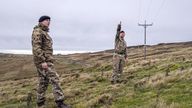Members of the armed forces check on overhead power cables in Weardale, County Durham