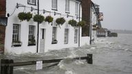 Sea water floods the shore line after high tide in Langstone, Hampshire, as Storm Barra hits the UK