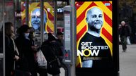 A government poster at a bus stop in London encourages people to get the booster jab