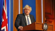 Prime Minister Boris Johnson speaks at a press conference in London&#39;s Downing Street, Wednesday Dec. 8, 2021, after ministers met to consider imposing new restrictions in response to rising cases and the spread of the omicron variant.