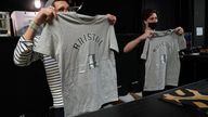 Salespersons in Rough Trade in Bristol, with a T-shirt designed by street artist Banksy