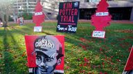 Posters stand on the south lawn at the Hennepin County Government Center in Minneapolis where jury selection has begun. Pic: AP