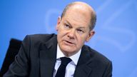 German Chancellor Olaf Scholz speaks at a news conference following a virtual meeting with Germany&#39;s federal state premiers to discuss the country&#39;s strategy against the spread of the coronavirus disease (COVID-19) pandemic, in Berlin, Germany December 21, 2021. Bernd von Jutrczenka/Pool via REUTERS