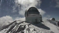 Time lapse images atop the Mauna Kea summit area show a winter-like front moving across the area dumping snow.