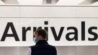 A man is seen waiting at the arrival area of terminal 5 following the lifting of restrictions on the entry of non-U.S. citizens imposed to help curb the spread of the coronavirus disease (COVID-19), at Heathrow International airport