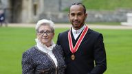 Sir Lewis Hamilton with his mother Carmen Lockhart after he was made a Knight Bachelor by the Prince of Wales during a investiture ceremony at Windsor Castle. Picture date: Wednesday December 15, 2021.
