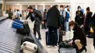 Passengers arrive at the terminal of the Newark Liberty International Airport in Newark, New Jersey, U.S., November 24, 2021. REUTERS/Eduardo Munoz 