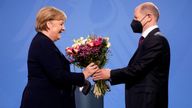 New elected German Chancellor Olaf Scholz, right, gives flowers to former Chancellor Angela Merkel during a handover ceremony in the chancellery in Berlin, Wednesday, Dec. 8, 2021. (Photo/Markus Schreiber)
PIC:AP


