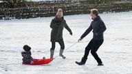 A family take advantage of the Christmas Day snow with a trip out sledging on the hills near Hexham, Northumberland. Early morning snowfall has been recorded in parts of the UK, with the Met Office declaring it a White Christmas.
