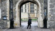 Police guard the Henry VIII gate at Windsor Castle at Windsor, England on Christmas Day, Saturday, Dec. 25, 2021. Britain&#39;s Queen Elizabeth II has stayed at Windsor Castle instead of spending Christmas at her Sandringham estate due to the ongoing COVID-19 pandemic. (AP Photo/Alastair Grant)
PI@AP