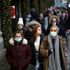 People walk past a Selfridge's store on Oxford Street, amid the COVID-19 outbreak in London