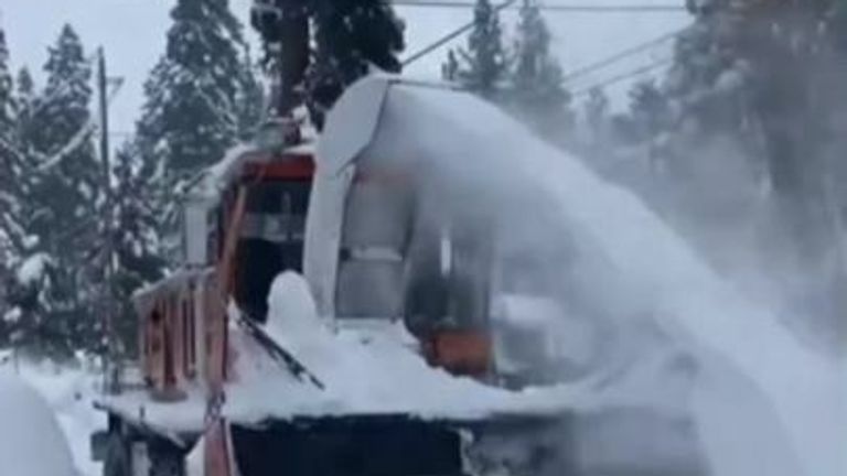 Videos near Lake Tahoe in California show record breaking levels of snow being cleared to help travellers get about safely.