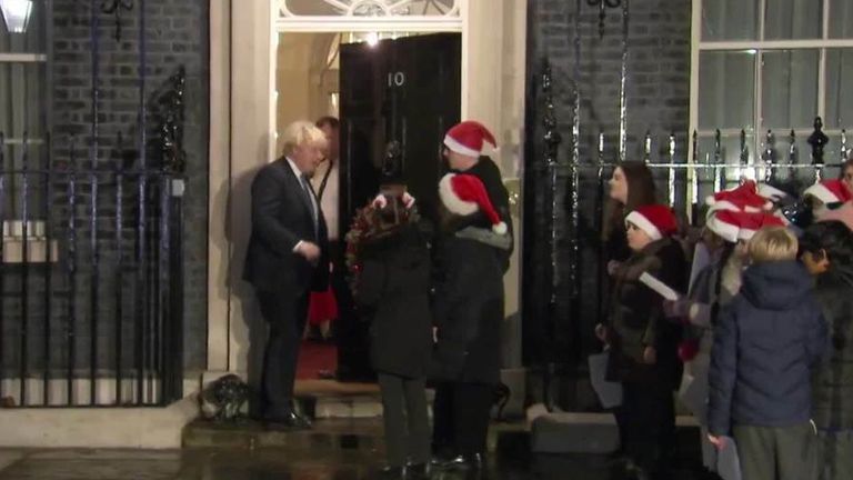 PM turns the lights on the Christmas tree in Downing Street. 