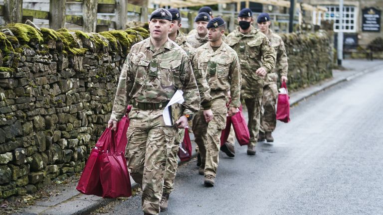Members of the armed forces have been handing out supplies to residents