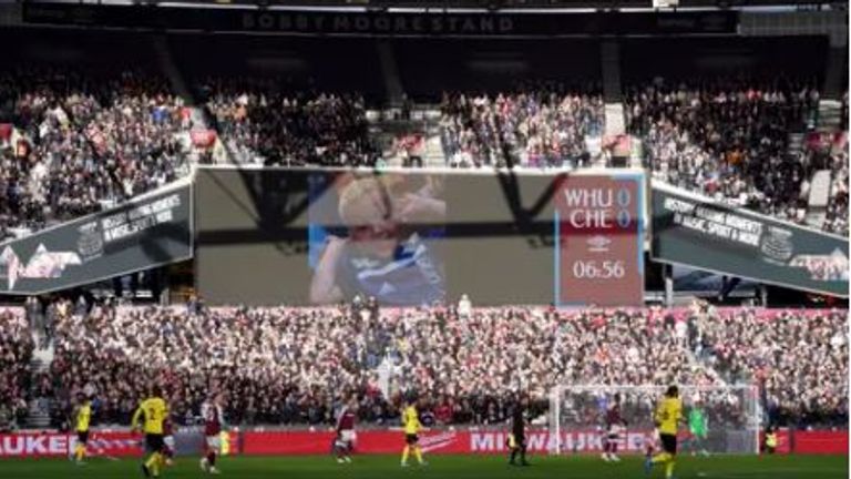 An image of Arthur is projected onto a screen at the West Ham v Chelsea game in London