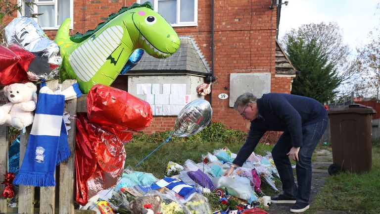 Conservative MP for Solihull Julian Knight leaves flowers outside the home of Arthur Labinjo-Hughes in Solihull, West Midlands
