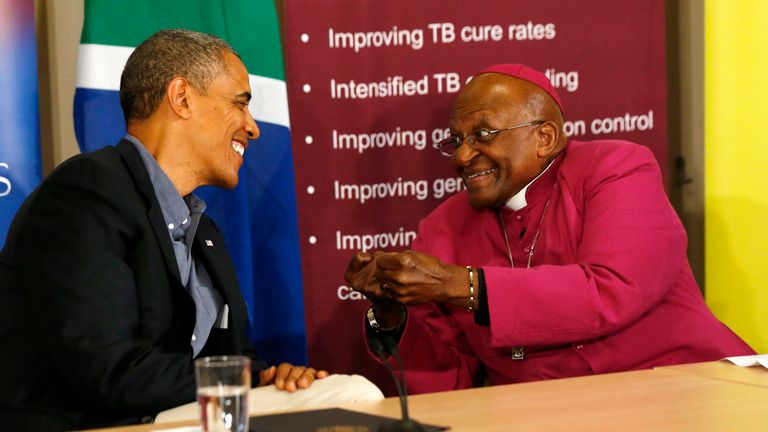 US President Barack Obama (L) listens to Desmond Tutu as he visits his HIV Foundation Youth Center and attends a youth health event in Cape Town, June 30, 2013