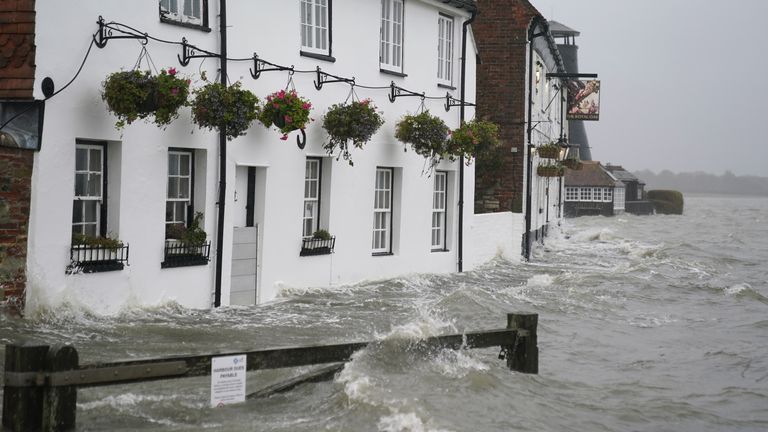 Sea water floods the shore line after high tide in Langstone, Hampshire, as Storm Barra hits the UK