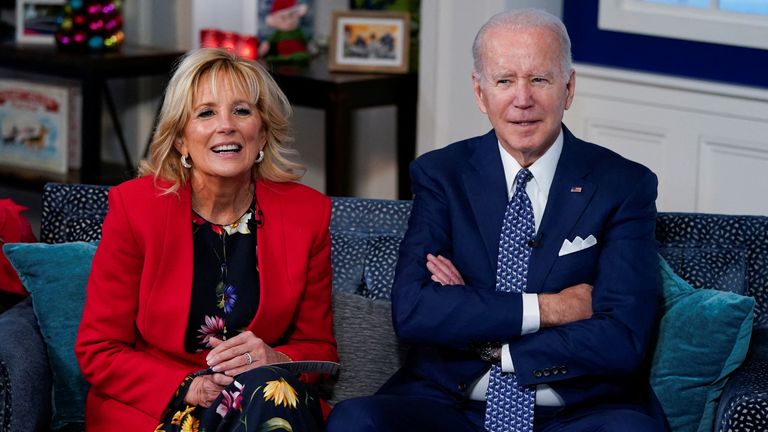 U.S. President Joe Biden and first lady Jill Biden participate in NORAD Santa tracker phone calls from South Court Auditorium at the White House in Washington, U.S., December 24, 2021. REUTERS/Elizabeth Frantz