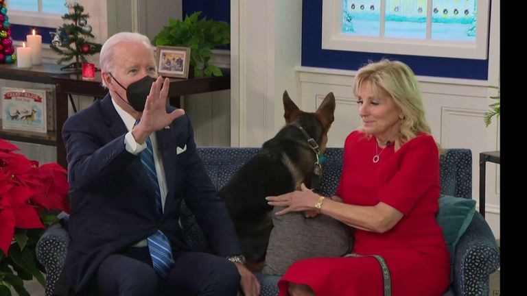 The Bidens and their puppy. Commander, wish US troops around the world a Merry Christmas
