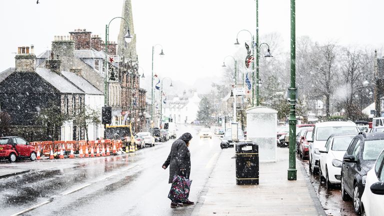 Sleet and snow fall in Biggar town centre, South Lanarkshire as Storm Barra hits the UK and Ireland with disruptive winds, heavy rain and snow on Tuesday. Picture date: Tuesday December 7, 2021.

