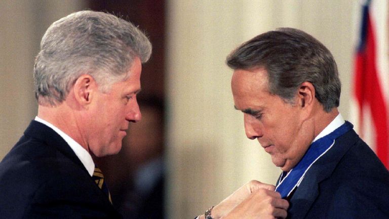 President Bill Clinton pinned the Presidential Medal of Freedom, the nation's highest civilian award, on Bob Dole in 1997. Pic: Reuters
