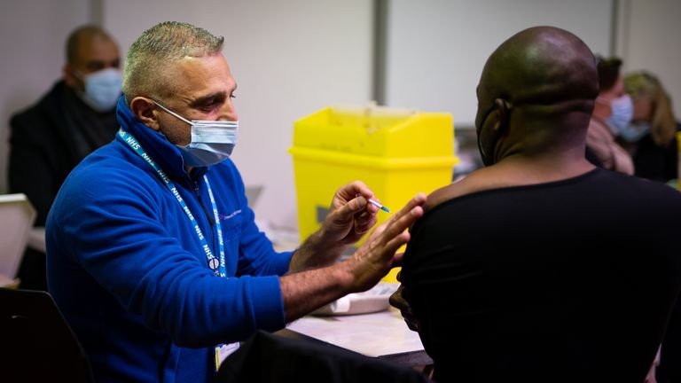 A man receives a Covid booster vaccine at the Abbey vaccination centre in Westminster, London. Picture date: Thursday December 2, 2021.

