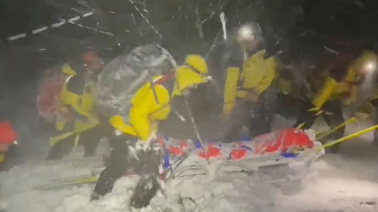 Mountain rescuers pull the stretcher through the snow. Pic: Cairngorm Mountain Rescue Team