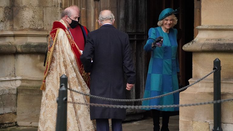 The Prince of Wales and the Duchess of Cornwall are greeted by the Dean of Windsor (left) as they arrive to attend the Christmas Day morning church service at St George&#39;s Chapel, Windsor Castle. Picture date: Saturday December 25, 2021.
