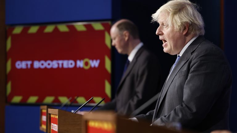 Chief Medical Officer for England Professor Chris Whitty (left) listens to Prime Minister Boris Johnson during a media briefing in Downing Street, London, on coronavirus (Covid-19). Picture date: Wednesday December 15, 2021.

