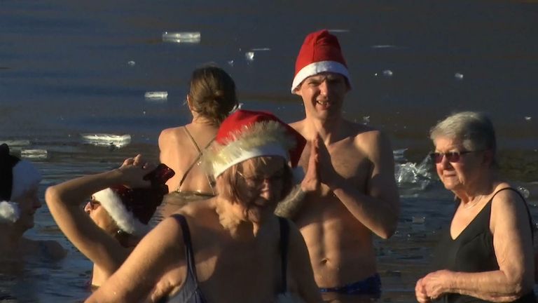 Germans take a dip into an icy lake on Christmas day