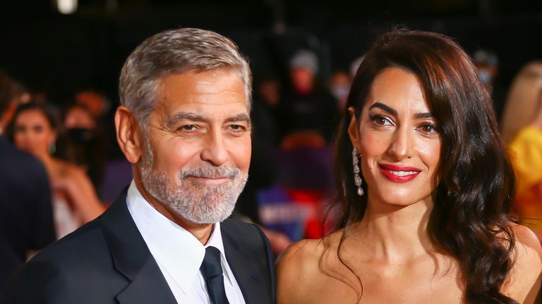 George Clooney, Amal Clooney and Grant Heslov pose for photographers upon arrival at the premiere of the film &#39;The &#39;Tender Bar&#39; during the 2021 BFI London Film Festival in London, Sunday, Oct. 10, 2021. (Photo by Joel C Ryan/Invision/AP)


