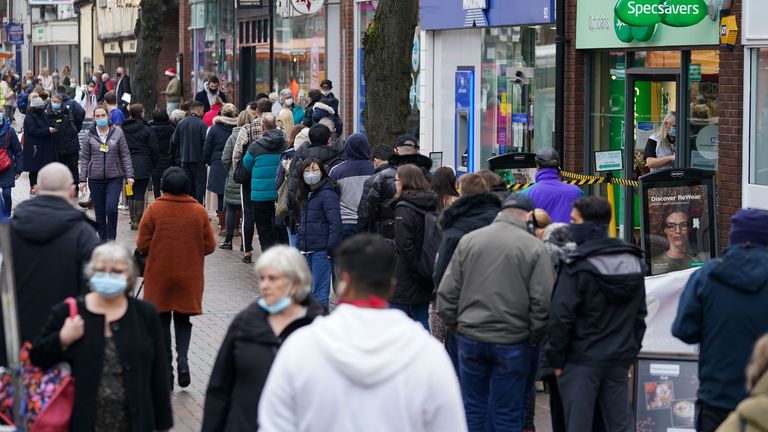 Hundreds of people queue at a vaccination centre on Solihull High Street, West Midlands, as the coronavirus booster vaccination programme is ramped up to an unprecedented pace of delivery, with every eligible adult in England being offered a top-up injection by the end of December. Picture date: Tuesday December 14, 2021.
