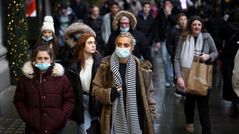 People walk past a Selfridge&#39;s store on Oxford Street, amid the COVID-19 outbreak in London