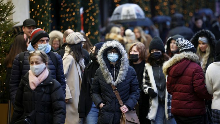People walk past a Selfridge&#39;s store on Oxford Street, amid the COVID-19 outbreak in London