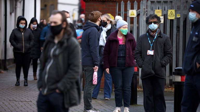 People queuing at a COVID-19 testing site in Ealing, West London earlier this year. 