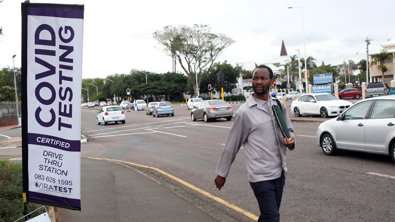 A man walks past a mobile COVID-19 testing centre in Durban, South Africa. Pic: AP