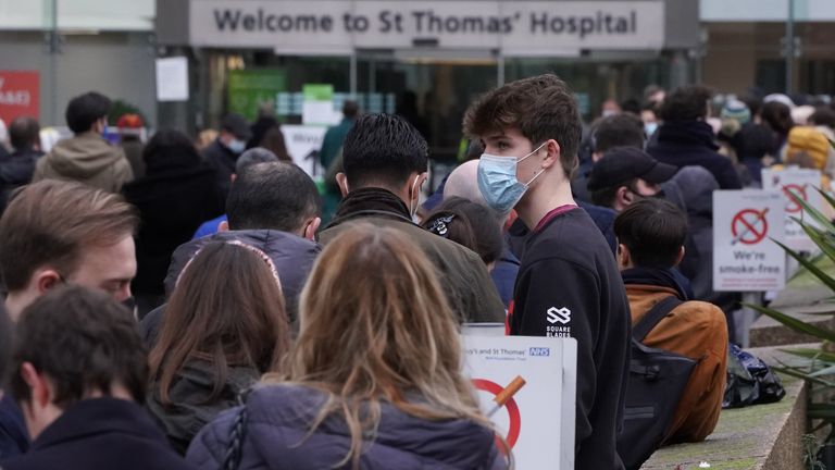 People queuing for booster jabs at St Thomas&#39; Hospital, London. Everyone over 18 in England will be offered booster jabs from this week, Prime Minister Boris Johnson said on Sunday night, as he declared an "Omicron emergency". Picture date: Monday December 13, 2021.