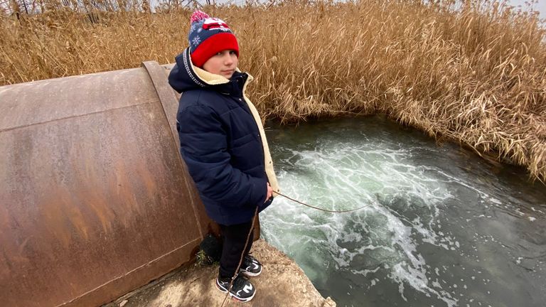 Danya Kharchenko goes fishing in a reservoir every day
