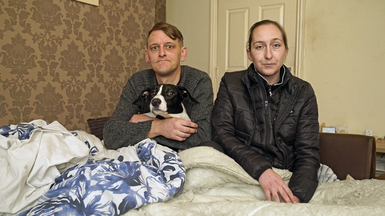 Christopher Bertram and Jessica Teasdale have been using their dog to help keep warm