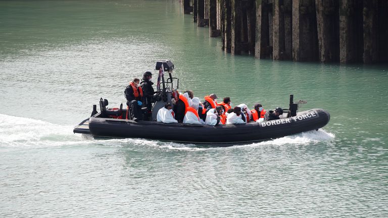 Border Patrol agents bring migrants into Dover harbour on a boat, after they tried to cross the channel, in Dover. Pic REUTERS
