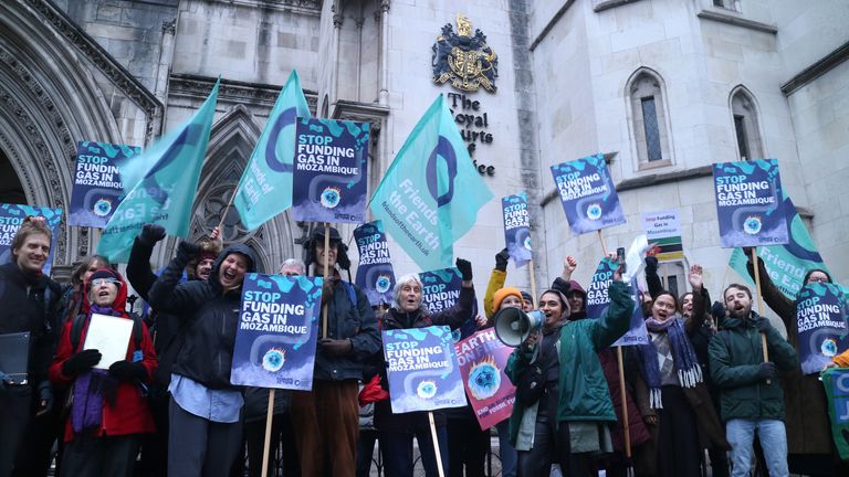 Activists outside the Royal Courts of Justice protest UK government funding for a Mozambique gas project. Pic: Friends of the Earth