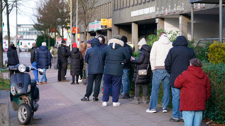 People queue outside a vaccination centre in Hamburg, Germany. Pic: AP