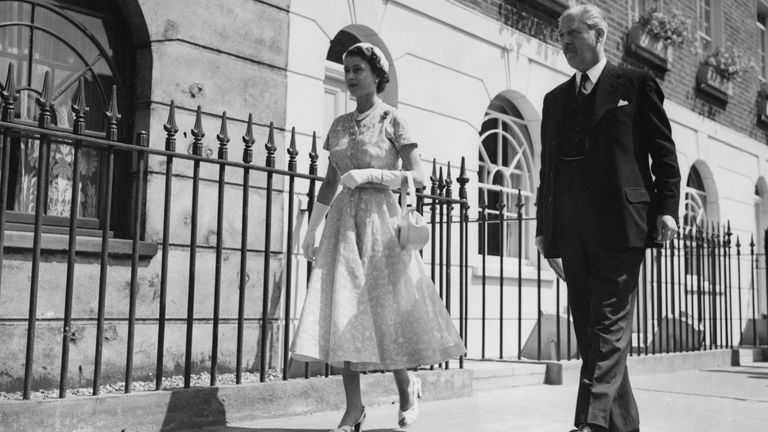 Queen Elizabeth II is shown the Ministry of Housing and Local Government&#39;s exhibition in Holles Street, off Oxford Street, London, by the Minister, Harold Macmillan. The exhibition demonstrates how an old house can be made more suitable for its occupants.