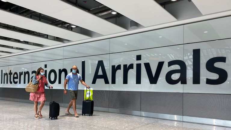 Passengers on international flights arrive at Heathrow Airport following the outbreak of coronavirus 