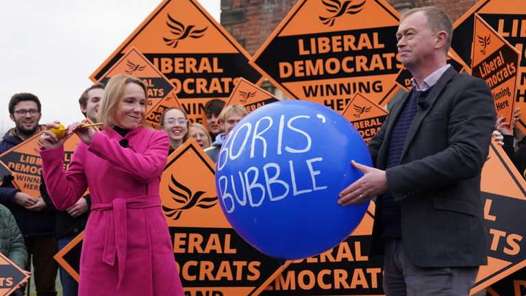 Newly elected Liberal Democrat MP Helen Morgan, bursts &#39;Boris&#39; bubble&#39; held by colleague Tim Farron, as she celebrates in Oswestry, Shropshire, following her victory in the North Shropshire by-electiom. Picture date: Friday December 17, 2021.

